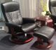 Stressless President Recliner in Black Leather with a Brown Walnut Wood Base Profile View with Classic Base